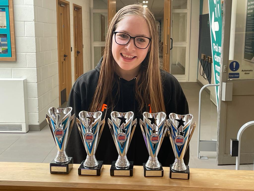 Amelia with her trophies