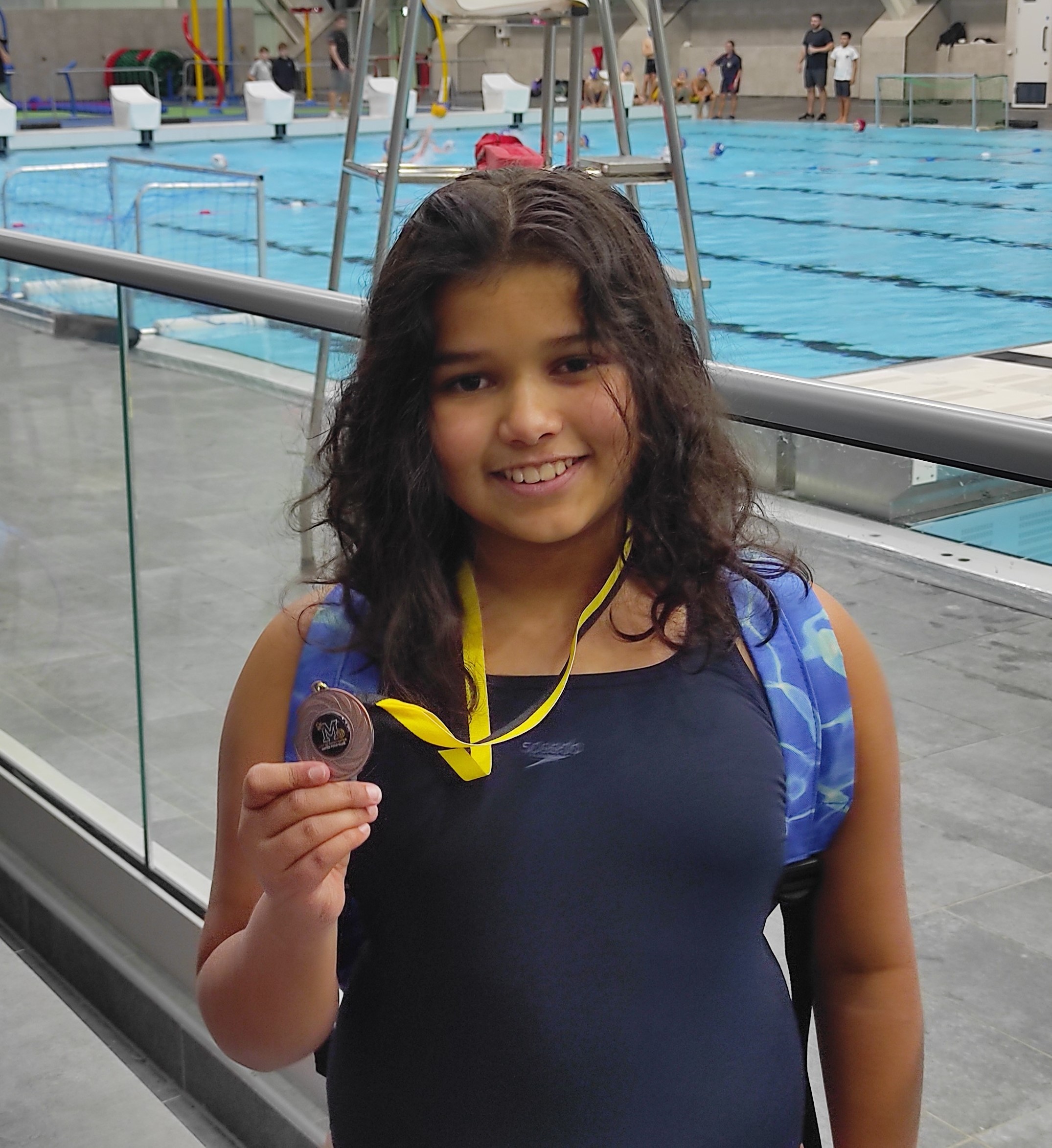 Pippa holding her bronze medal