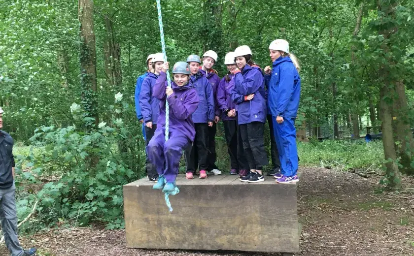 Girls taking part in assault course