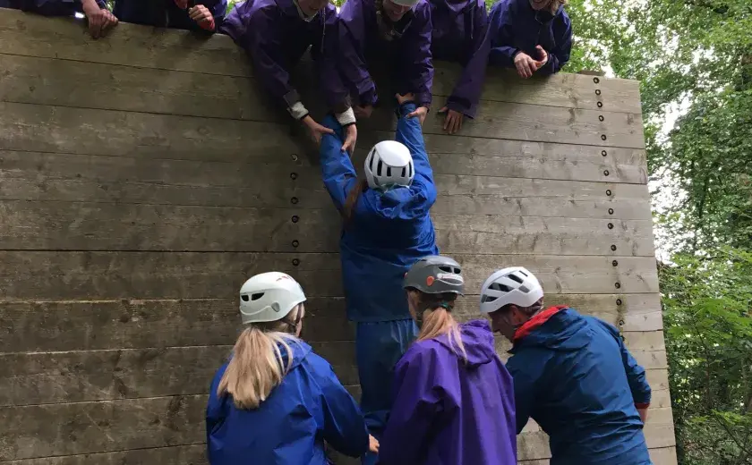 Girls taking part in assault course