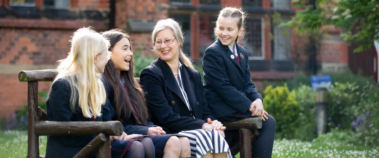 Queen's headmistress with senior school girls